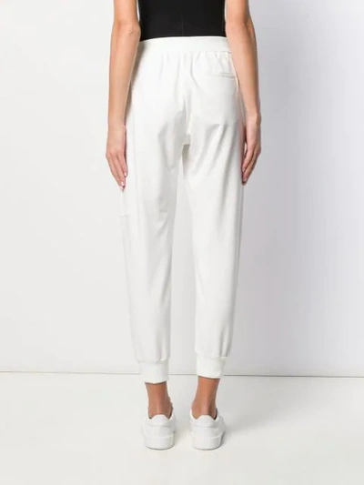 Shop Brunello Cucinelli Tapered Track Pants In White
