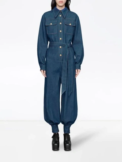 Shop Gucci Belted Denim Jumpsuit In Blue