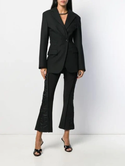 Shop Mugler Contrast Panel Trousers In Black