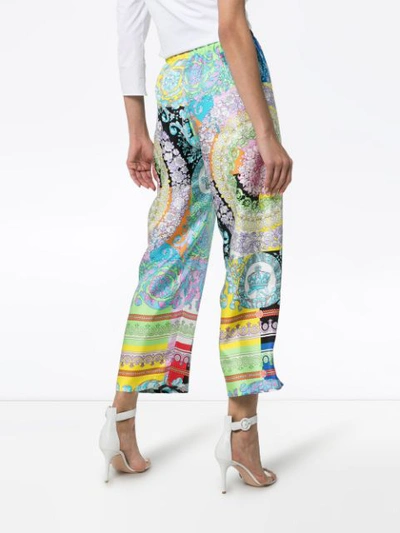 Shop Versace Wild Baroque Print Trousers In Blue