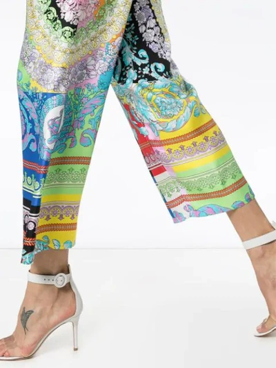 Shop Versace Wild Baroque Print Trousers In Blue