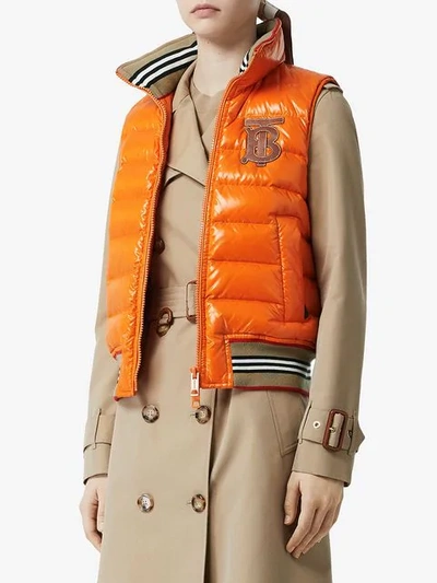 Shop Burberry Icon Stripe Detail Down-filled Puffer Gilet In Orange