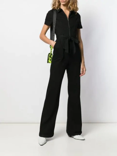 Shop Alice And Olivia Flared Jumpsuit In Black