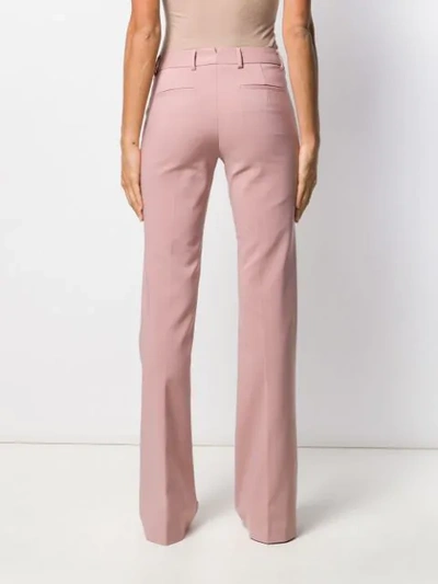 Shop Tonello Flared Style Trousers In Pink