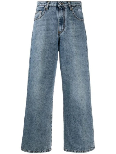 Shop Msgm Cropped Distressed Jeans In Blue