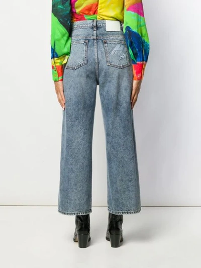 Shop Msgm Cropped Distressed Jeans In Blue
