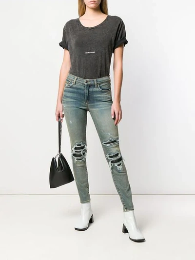 Shop Amiri Ripped Detailed Jeans In Blue