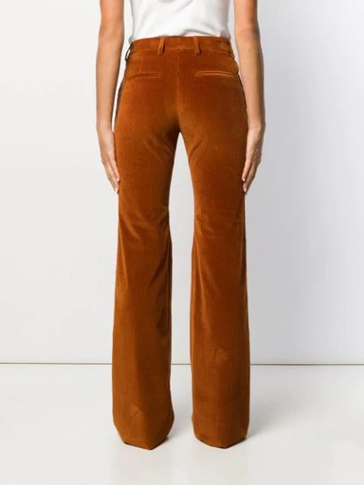 Shop Etro Flared Style Trousers In Brown