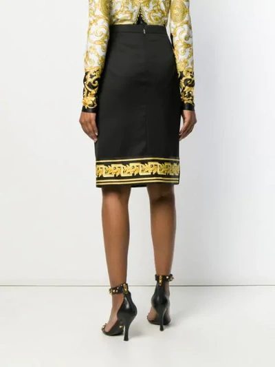 Shop Versace Printed Hem Pencil Skirt In Black