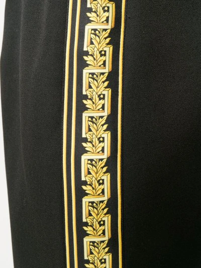 Shop Versace Printed Hem Pencil Skirt In Black