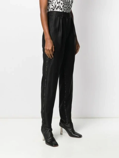 Shop Balmain Lamé Tapered Trousers In Black