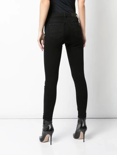 Shop Amiri Stack Skinny Jeans In Black