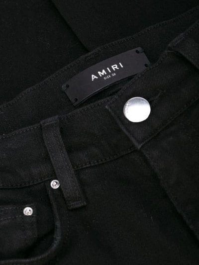 Shop Amiri Stack Skinny Jeans In Black