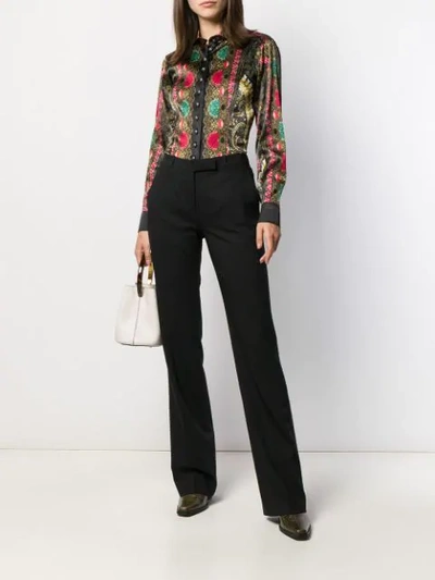 Shop Etro Flared Style Trousers In Black