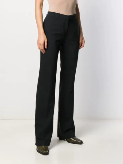 Shop Etro Flared Style Trousers In Black