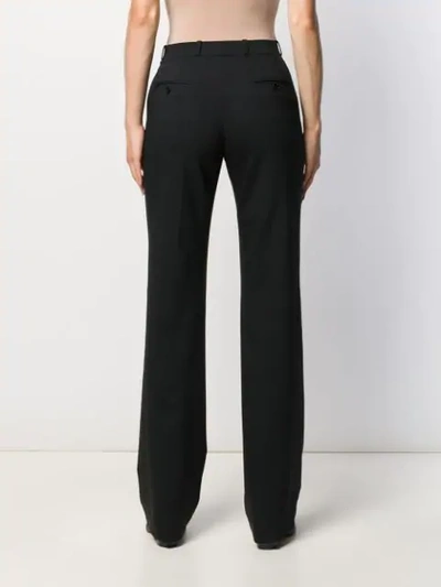 Shop Etro Flared Style Trousers In Black