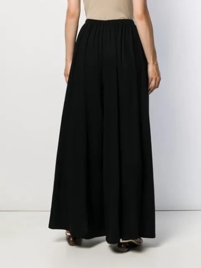 Shop The Row Palazzo Trousers In Black