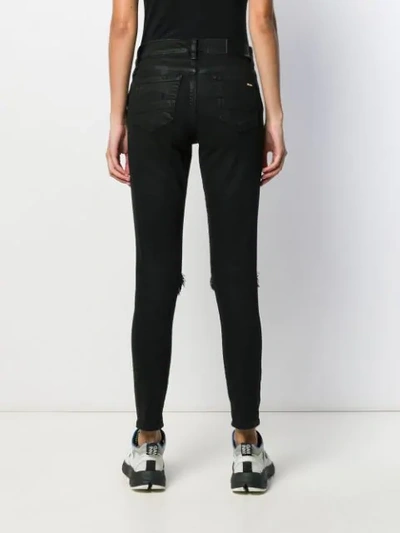 Shop Amiri Thrasher Minimal Skinny Jeans In Black