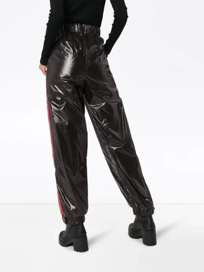 Shop Moncler Side-stripe Nylon Trousers In Black