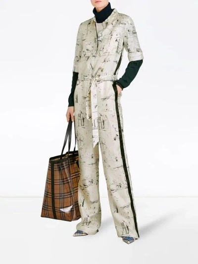 Shop Burberry Landmark Print Silk Jumpsuit In White