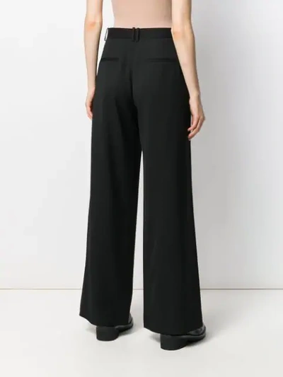 Shop The Row Palazzo Pants In Black