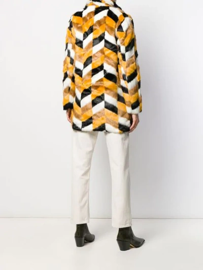 Shop Apparis Camille Faux-fur Chevron Coat In Yellow