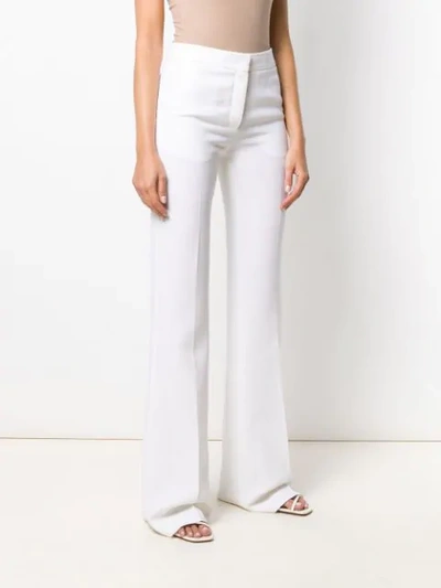 Shop Emilio Pucci High-waist Flared Trousers In White