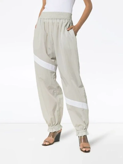 Shop Ganni Striped Flared Cuff Track Pants In Grey