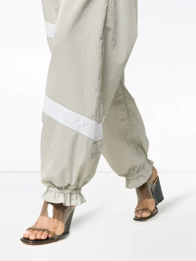 Shop Ganni Striped Flared Cuff Track Pants In Grey