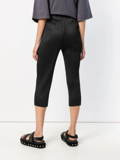 Shop Issey Miyake Pleated Cropped Trousers In Black