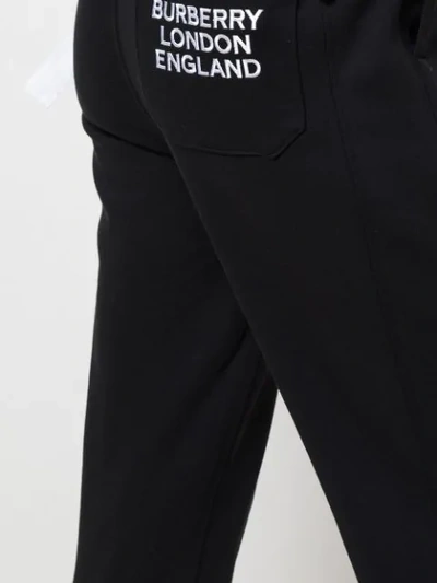 Shop Burberry Embroidered Logo Track Trousers In Black