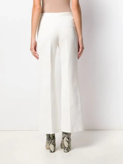 Shop Givenchy Flared Braided Trousers In White
