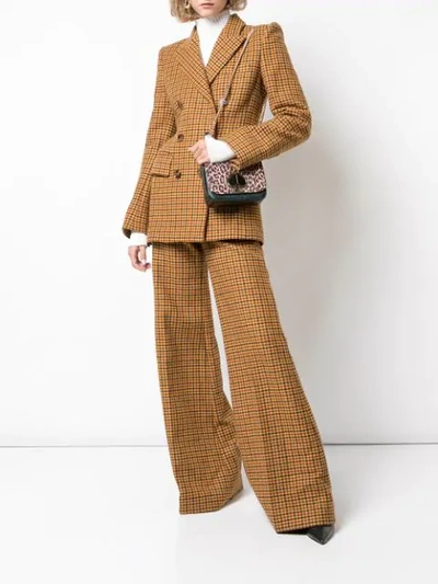 Shop Khaite Flared Gingham Trousers In Brown