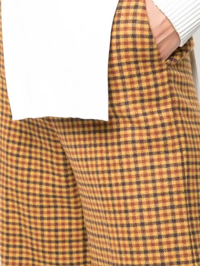 Shop Khaite Flared Gingham Trousers In Brown