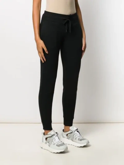 Shop Dkny Leopard Logo Track Pants In Black