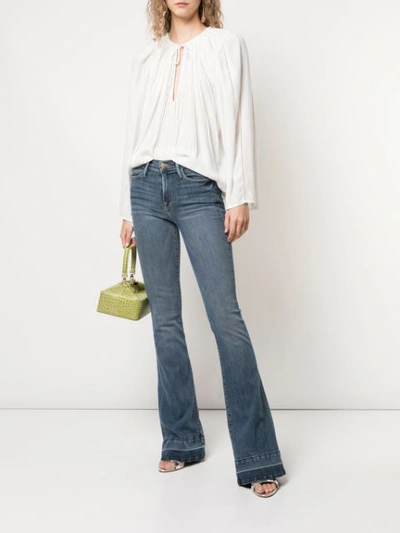 Shop Frame Le High Flared Jeans In Blue