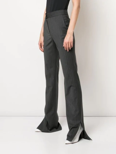 Shop Tibi Flared Pinstripe Trousers In Grey