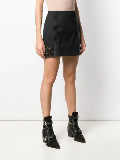 Shop Versace Fitted Side Buckles Short Skirt In Black