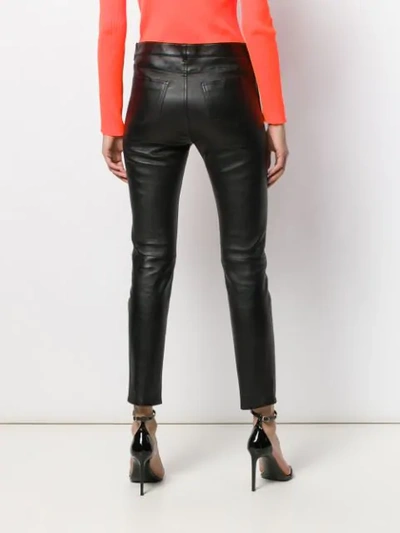 Shop Saint Laurent Skinny Leather Trousers In Black