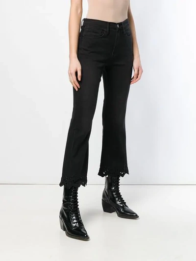 Shop Frame Flared Cropped Jeans In Black