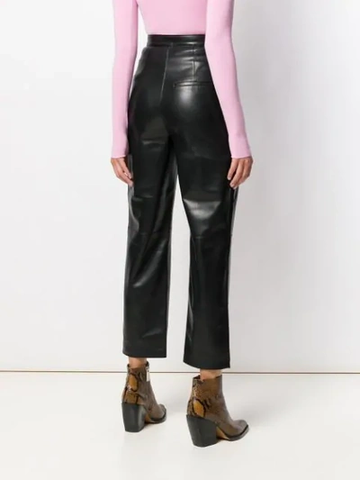 Shop Nanushka Vegan Leather High Waisted Trousers In Black