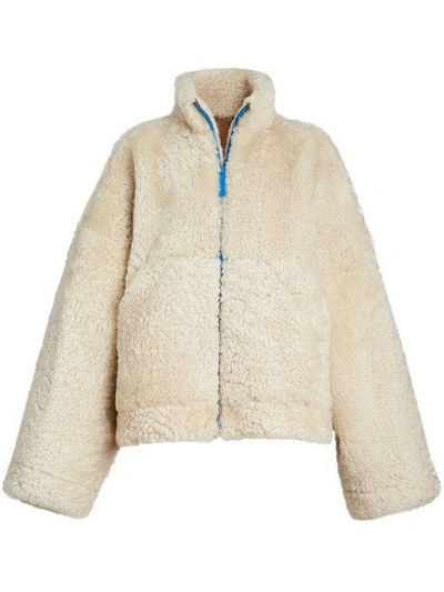Shop Burberry Contrast Zip Shearling Funnel-neck Jacket In White