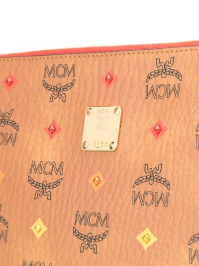 Shop Mcm Logo Print Clutch In Brown