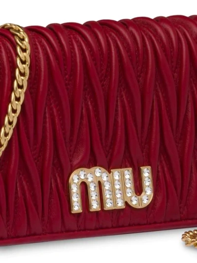 Shop Miu Miu Matelassé Mini Clutch Bag In Red