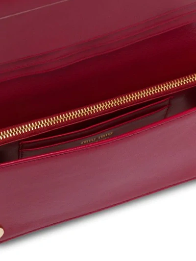 Shop Miu Miu Matelassé Mini Clutch Bag In Red