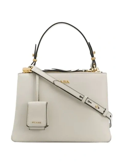 Shop Prada Handtasche Mit Logo-schild In White