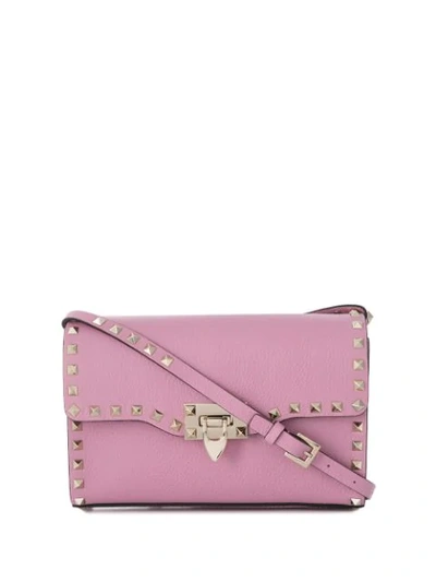 Shop Valentino Garavani Small Rockstud Crossbody Bag In Pink