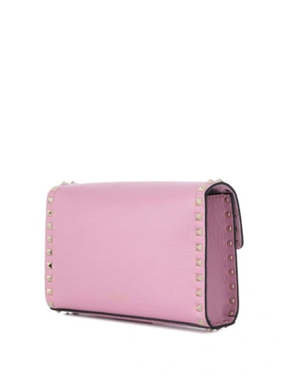 Shop Valentino Garavani Small Rockstud Crossbody Bag In Pink