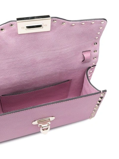 Shop Valentino Garavani Small Rockstud Crossbody Bag In Pink