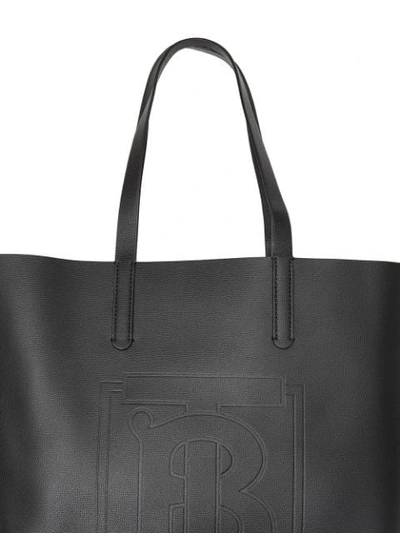 Shop Burberry Large Embossed Monogram Motif Leather Tote In Black